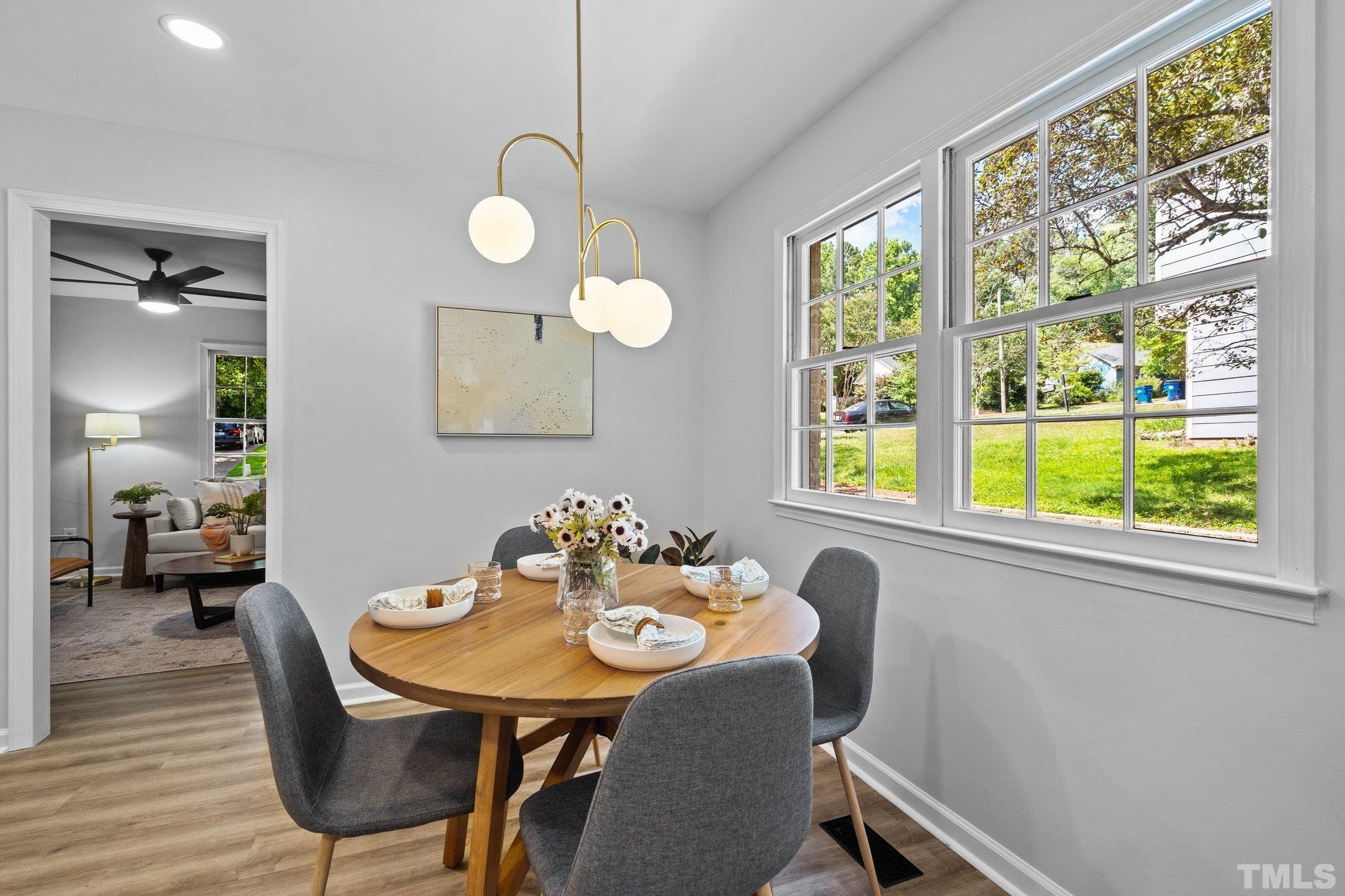 1013 Mockingbird Drive Raleigh, NC 27615 - Photo 16 of 41 a view of a dining room with furniture window and outside view