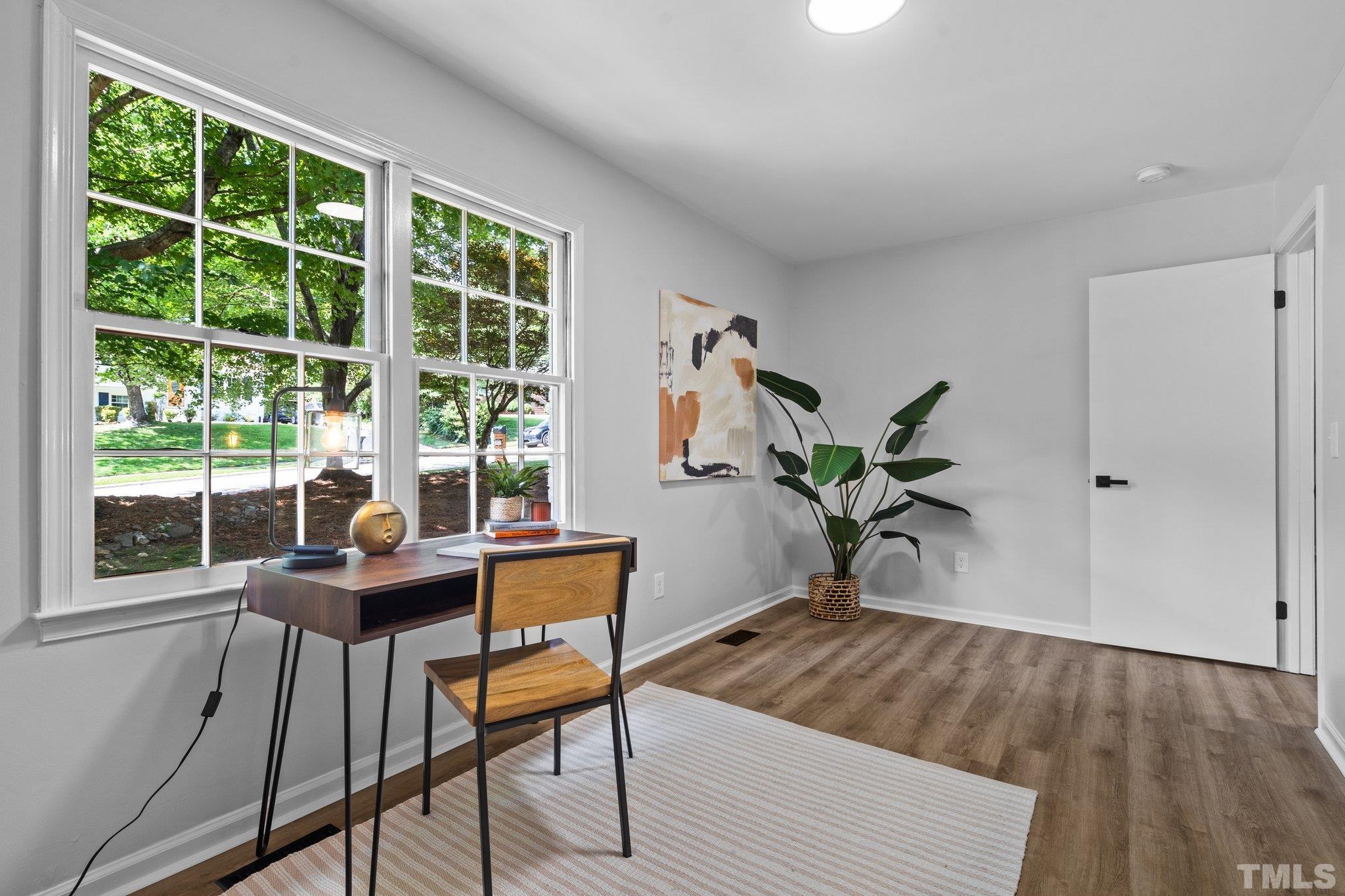 1013 Mockingbird Drive Raleigh, NC 27615 - Photo 20 of 41 a view of a workspace with furniture and a window