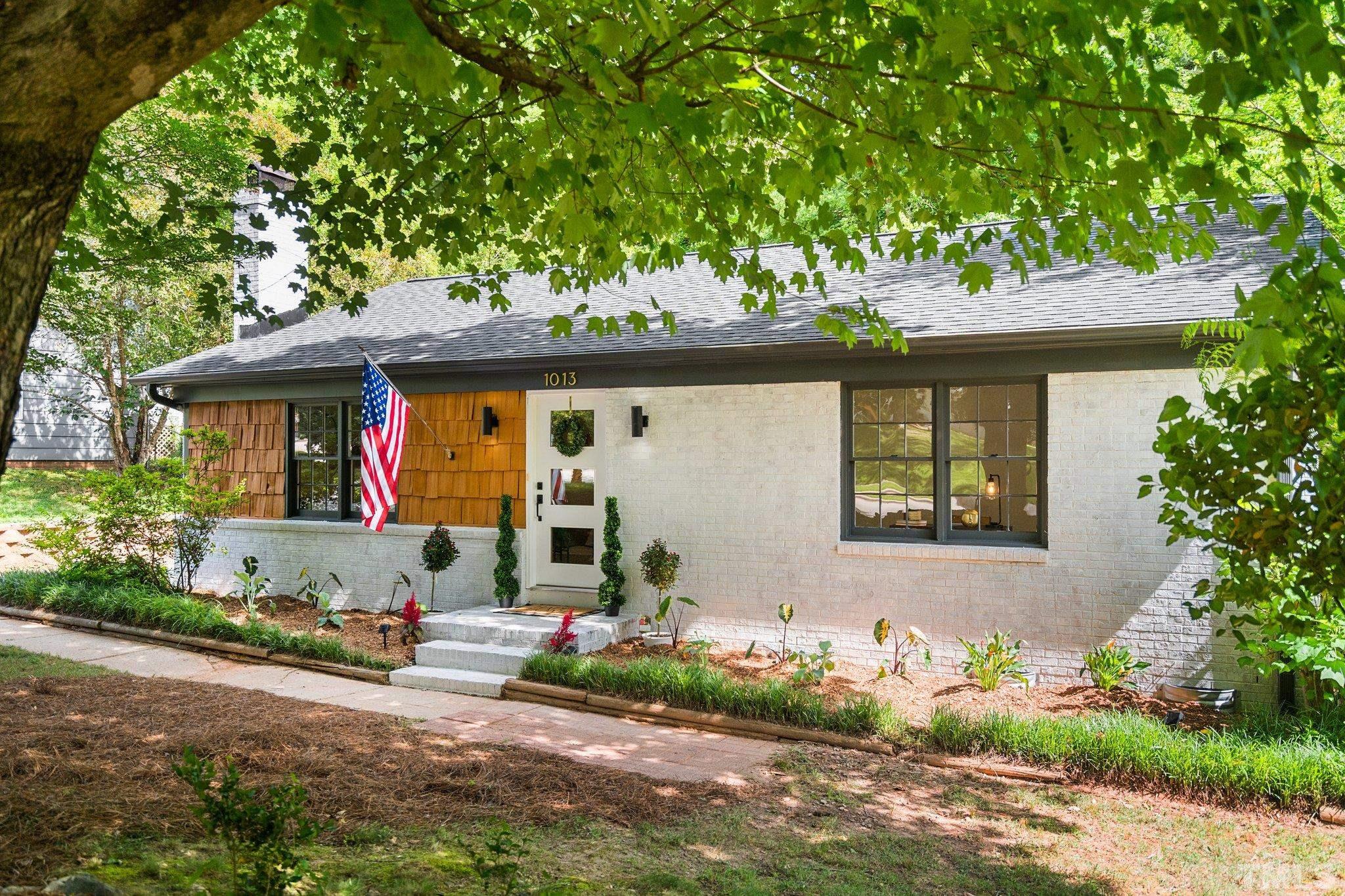 1013 Mockingbird Drive Raleigh, NC 27615 - Photo 2 of 41 a front view of a house with garden
