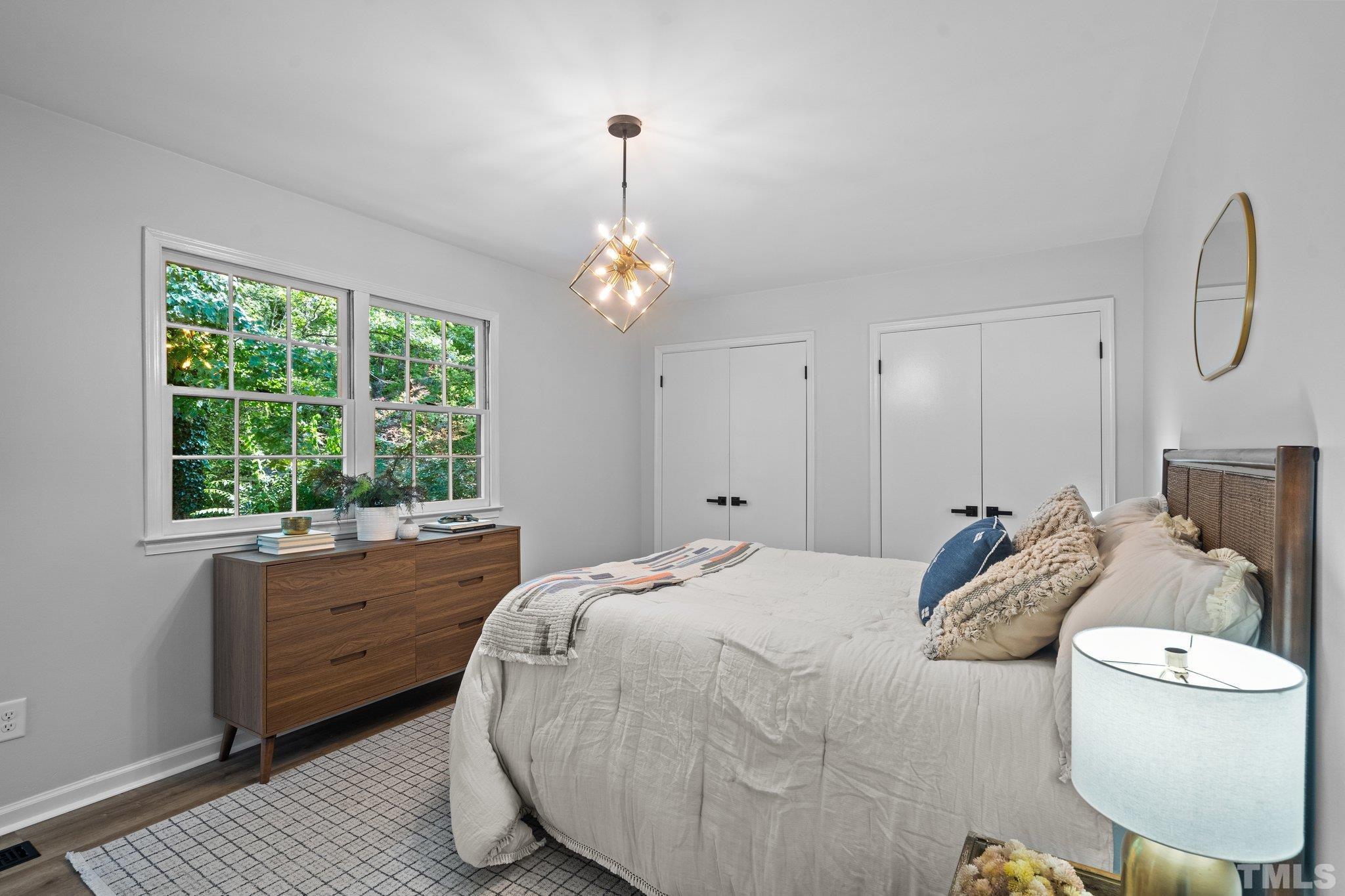 1013 Mockingbird Drive Raleigh, NC 27615 - Photo 24 of 41 a bedroom with a bed and a window