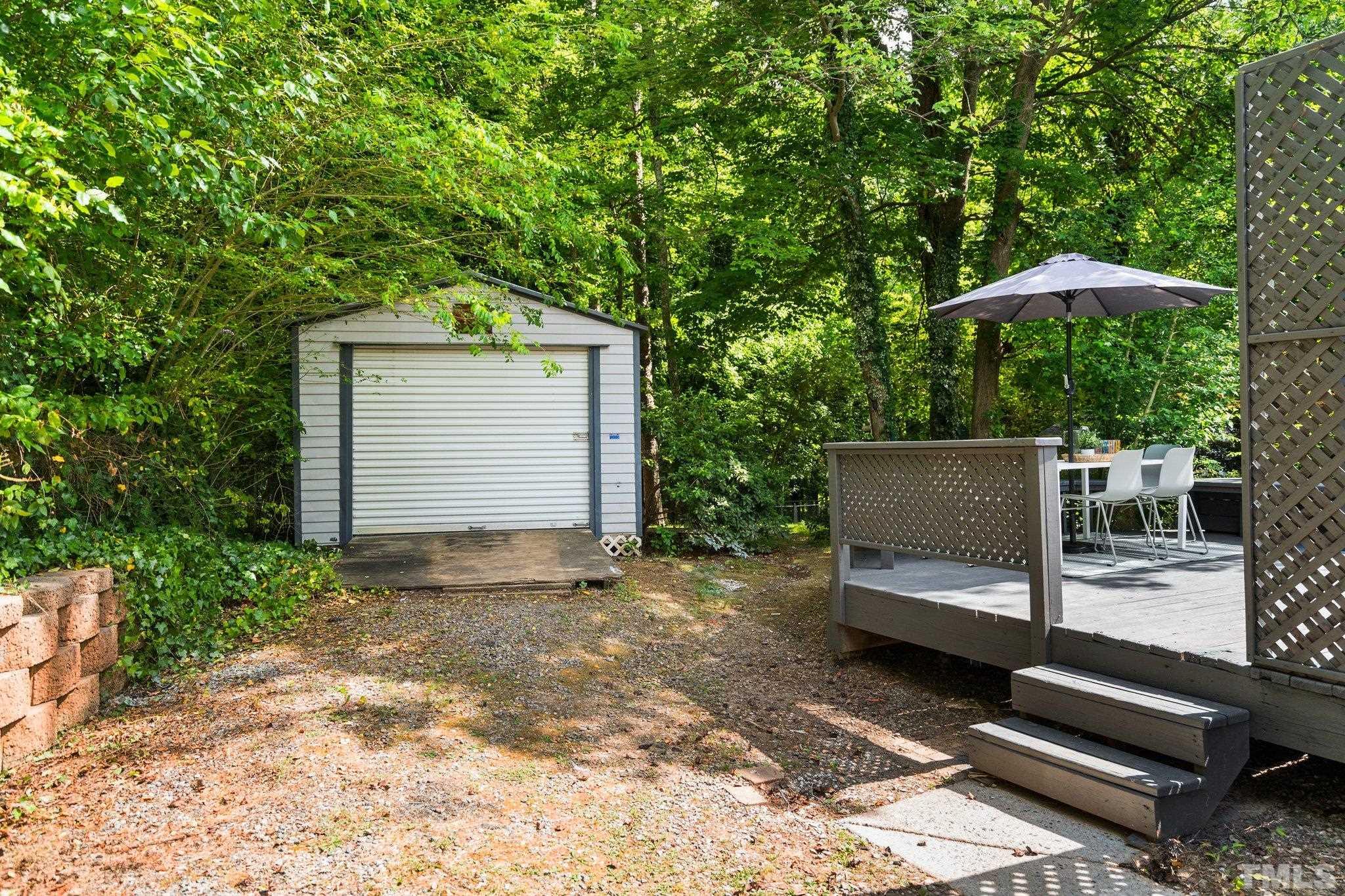 1013 Mockingbird Drive Raleigh, NC 27615 - Photo 29 of 41 a front view of a house with garden