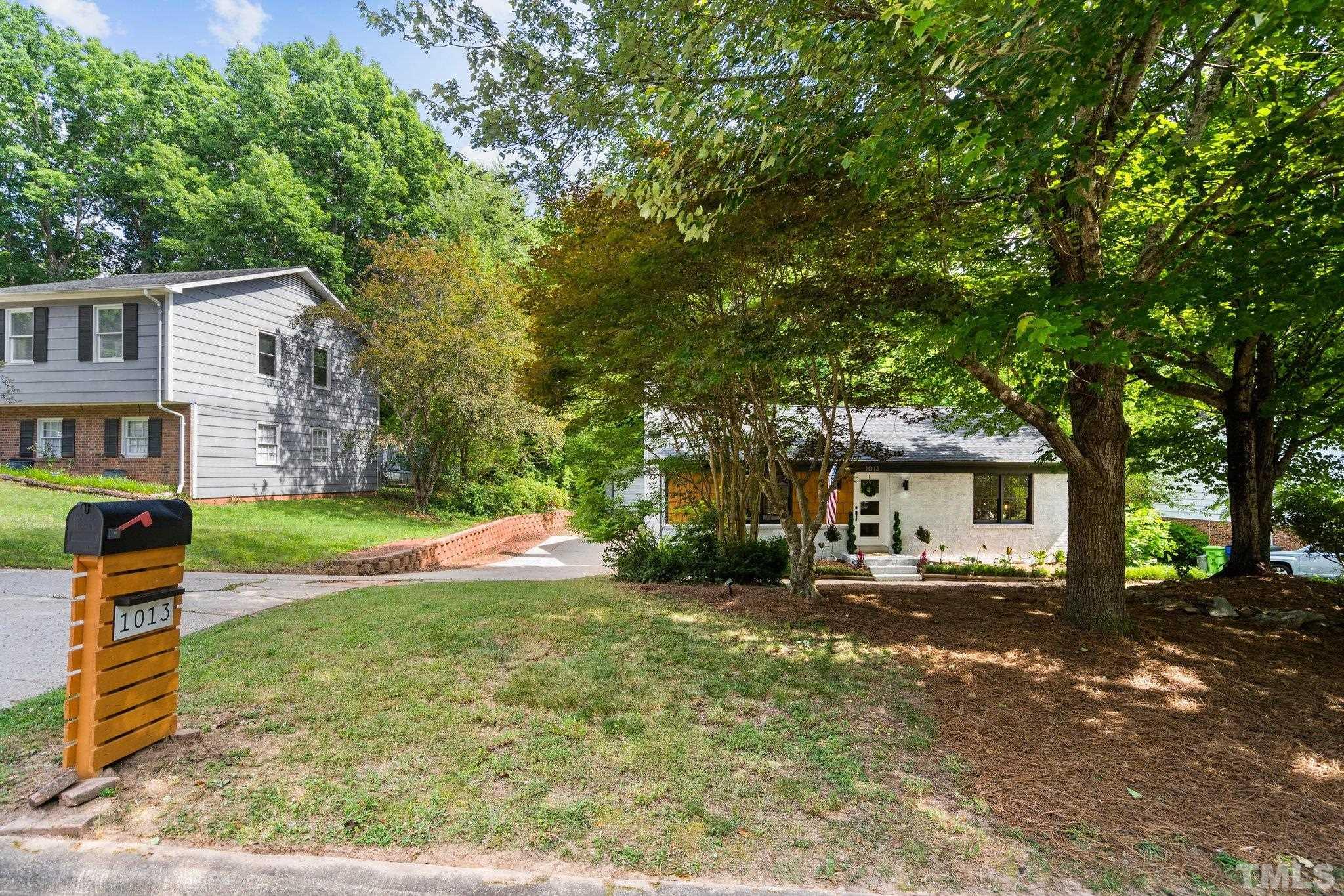 1013 Mockingbird Drive Raleigh, NC 27615 - Photo 4 of 41 a view of a house with a yard