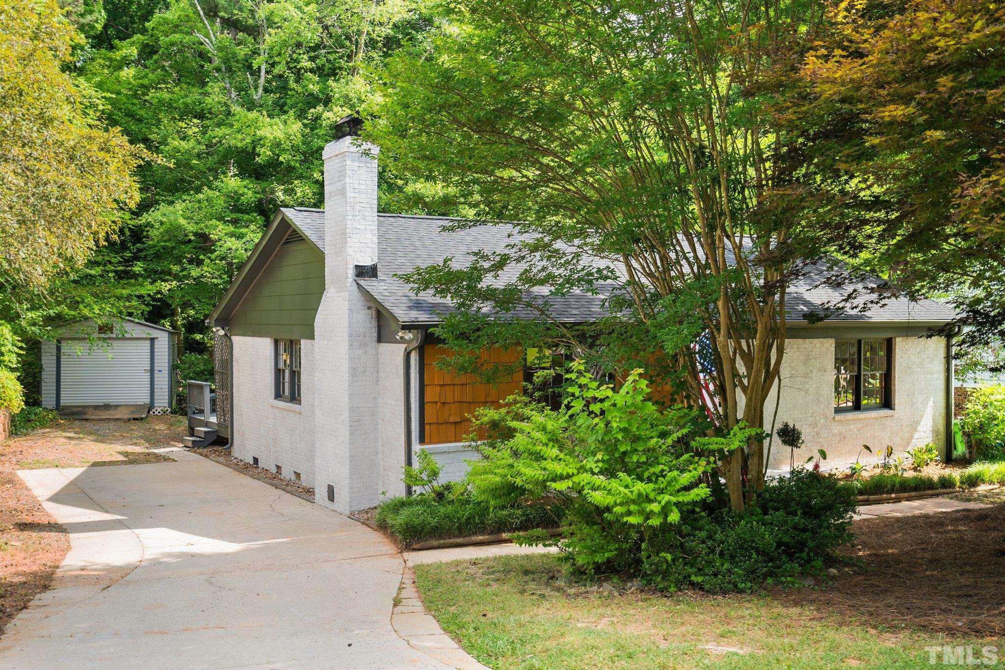 1013 Mockingbird Drive Raleigh, NC 27615 - Photo 5 of 41 a front view of a house with garden