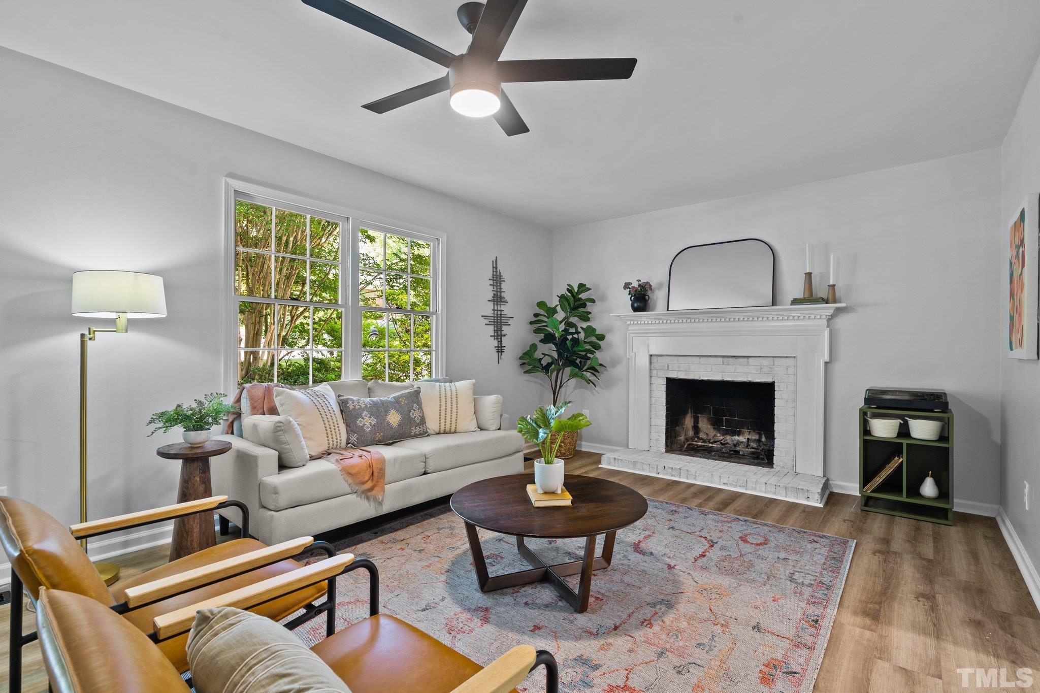 1013 Mockingbird Drive Raleigh, NC 27615 - Photo 8 of 41 a living room with furniture and a fireplace