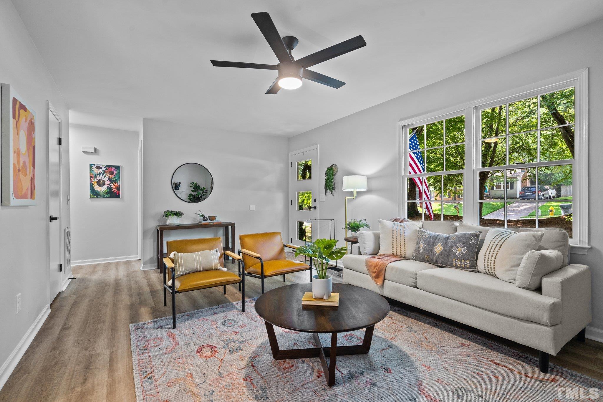 1013 Mockingbird Drive Raleigh, NC 27615 - Photo 9 of 41 a living room with furniture and a large window