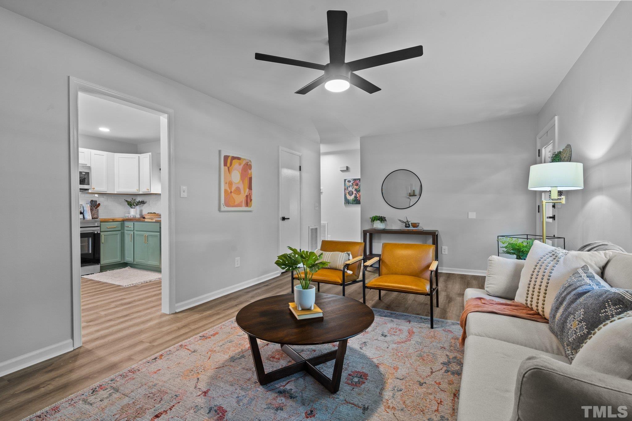 1013 Mockingbird Drive Raleigh, NC 27615 - Photo 10 of 41 a living room with furniture a rug and a window