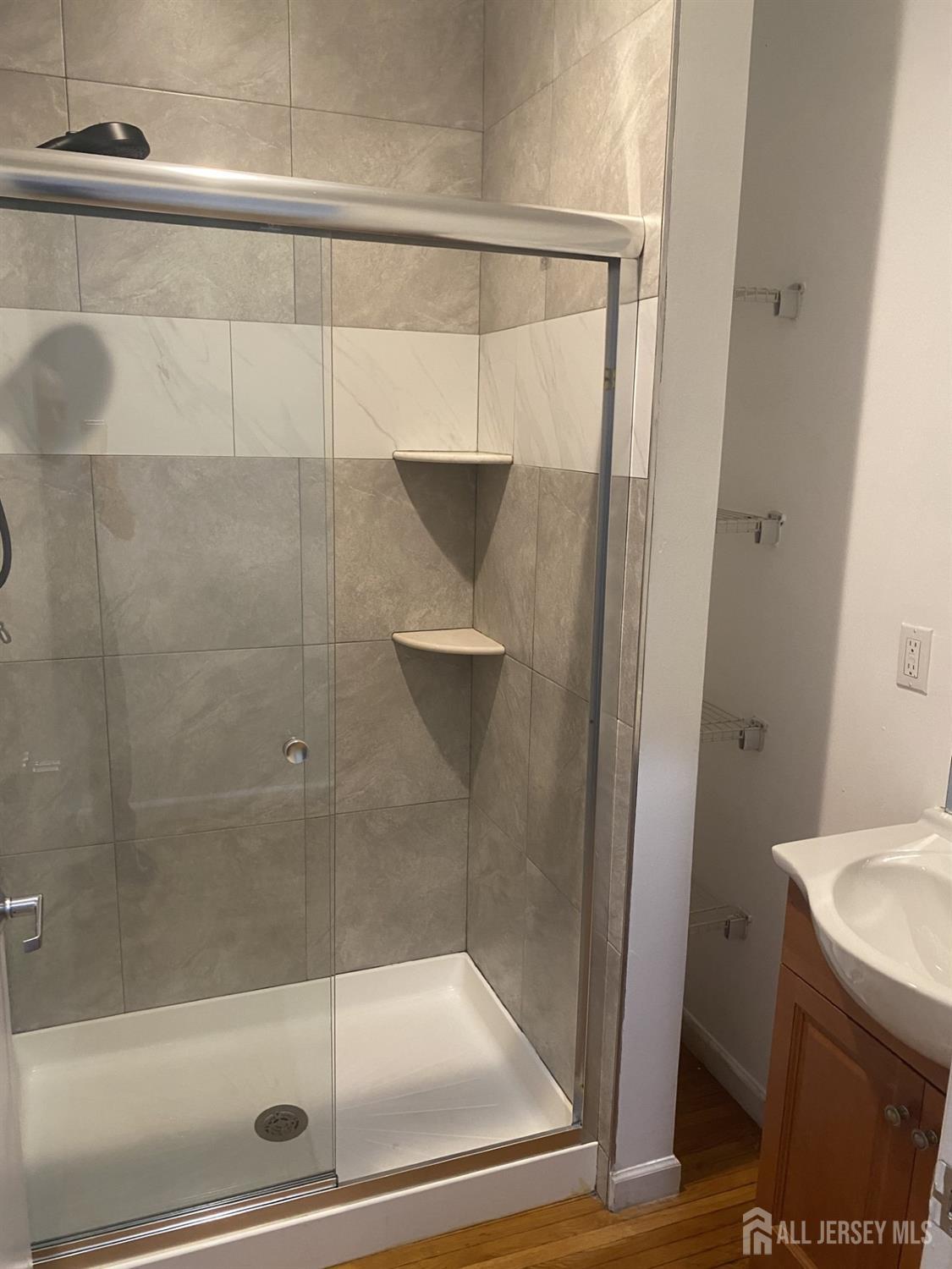 378 George Street, Unit 201 New Brunswick, NJ 08901 - Photo 5 of 10 a bathroom with a shower