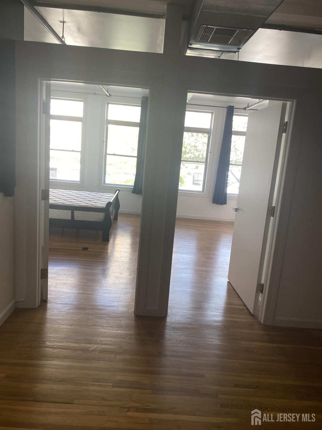 378 George Street, Unit 201 New Brunswick, NJ 08901 - Photo 6 of 10 a view of gallery with wooden floor