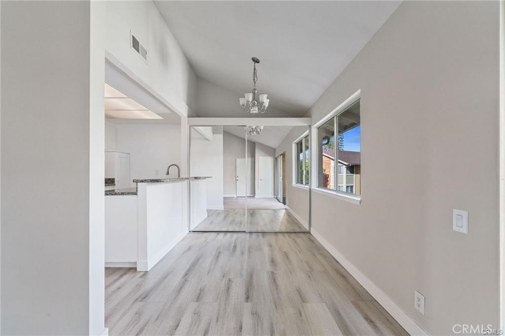 16040 Leffingwell Road, Unit 30 Whittier, CA 90603 - Photo 14 of 15 a view of a hallway view with wooden floor and staircase