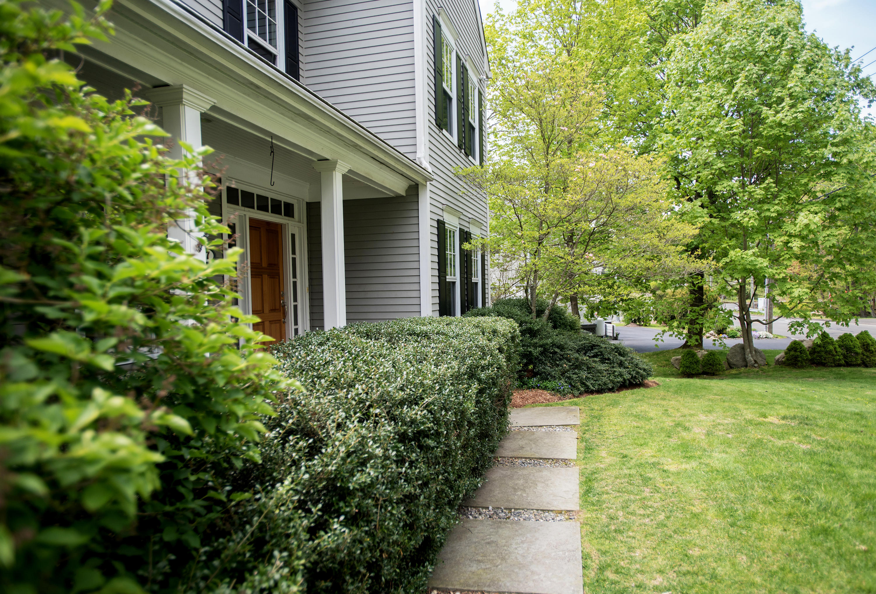 17 Brushy Ridge Road New Canaan, CT 06840 - Photo 2 of 35 a view of a house with a yard