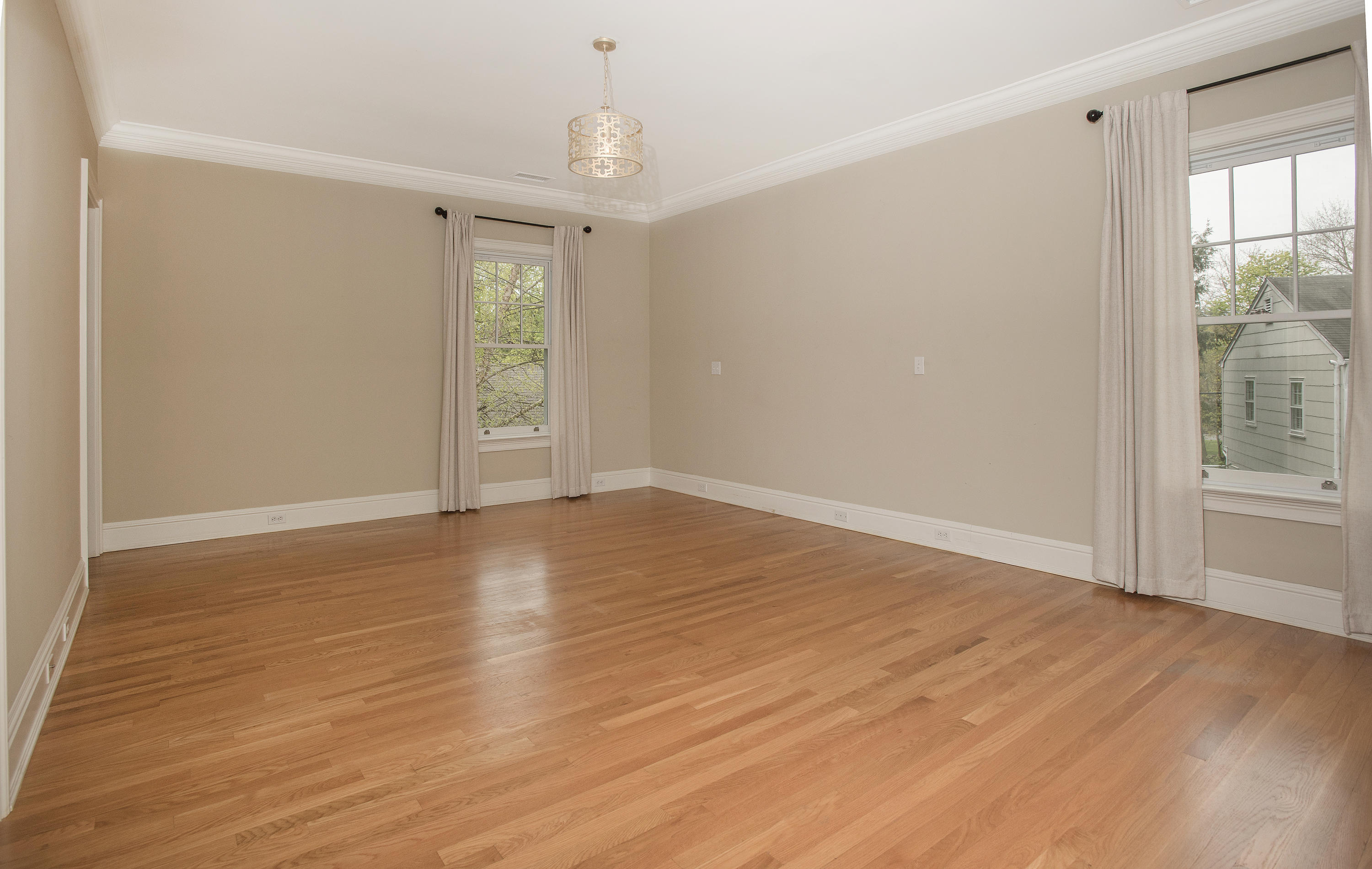 17 Brushy Ridge Road New Canaan, CT 06840 - Photo 13 of 35 a view of an empty room with wooden floor and a window