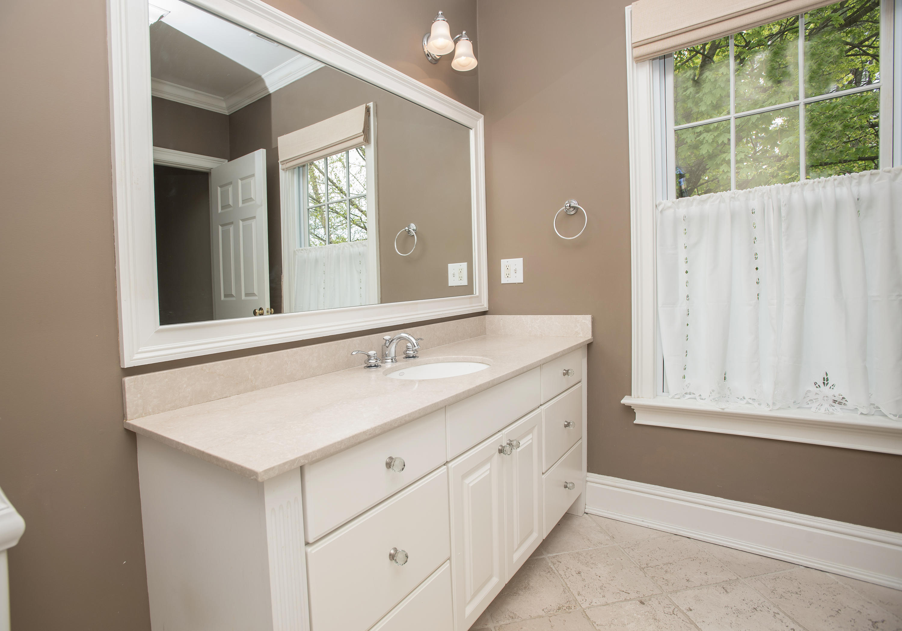 17 Brushy Ridge Road New Canaan, CT 06840 - Photo 14 of 35 a bathroom with a sink and a mirror