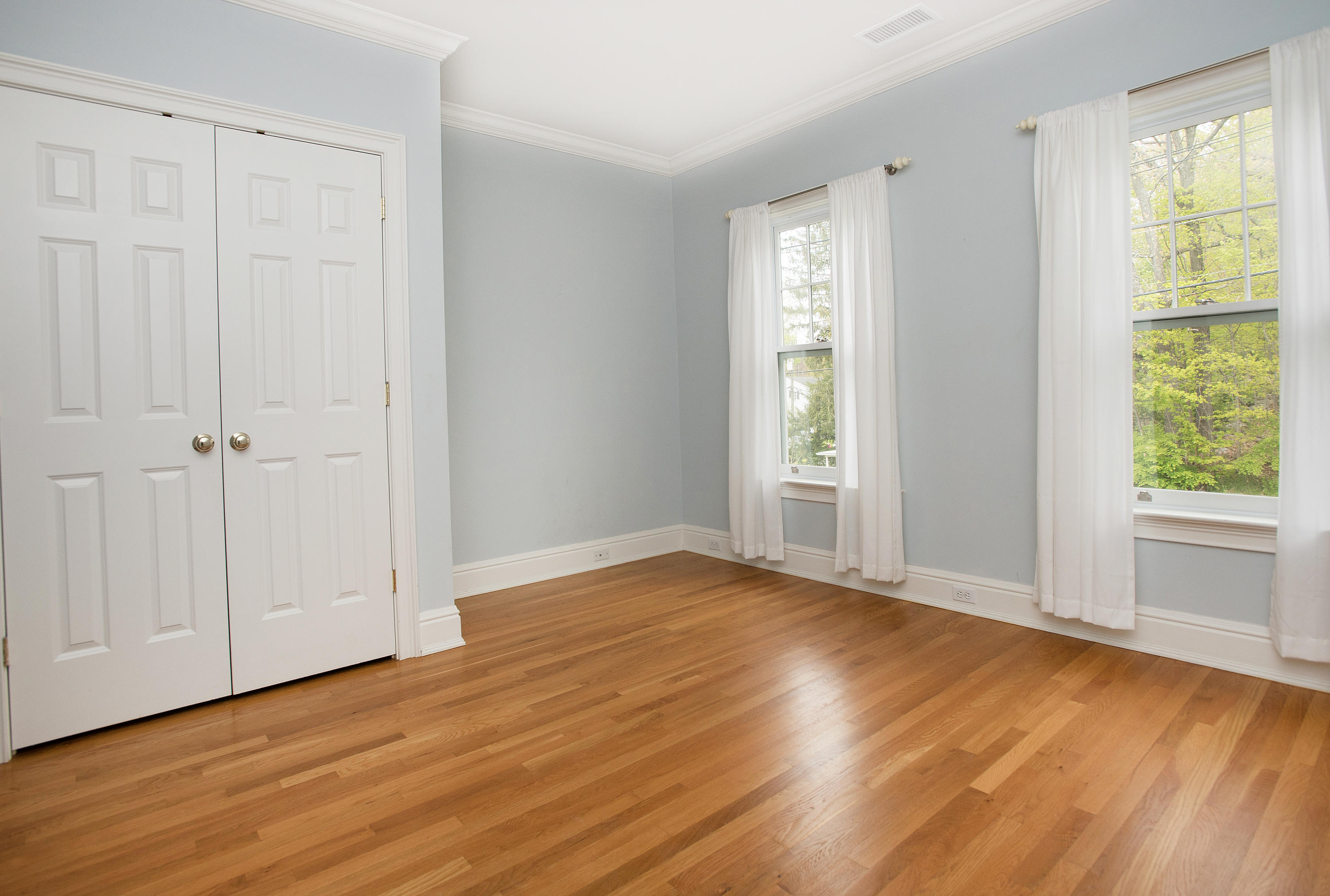 17 Brushy Ridge Road New Canaan, CT 06840 - Photo 18 of 35 a view of an empty room with wooden floor and a window