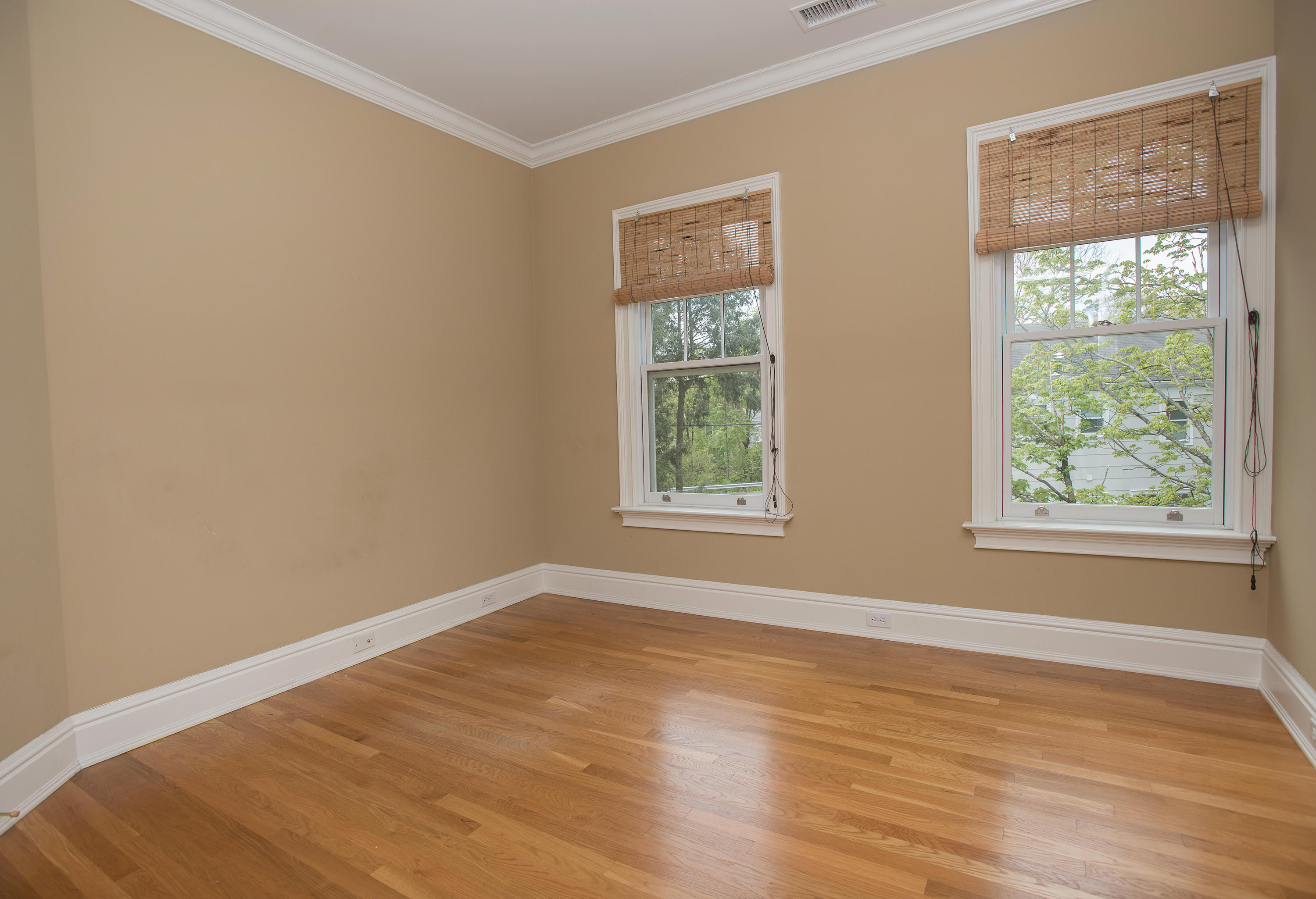 17 Brushy Ridge Road New Canaan, CT 06840 - Photo 19 of 35 a view of an empty room with wooden floor and a window