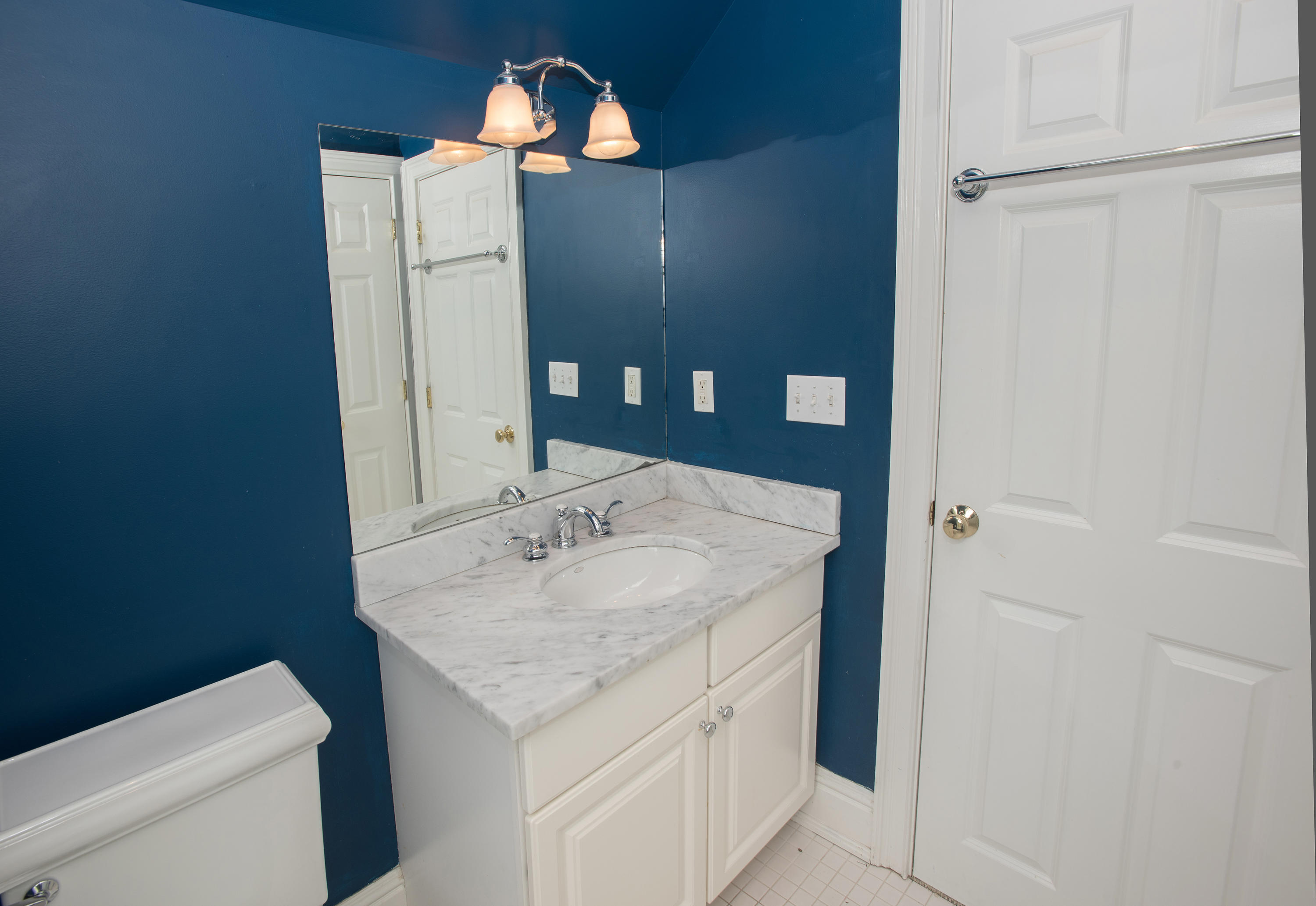17 Brushy Ridge Road New Canaan, CT 06840 - Photo 25 of 35 a bathroom with a granite countertop sink and a mirror