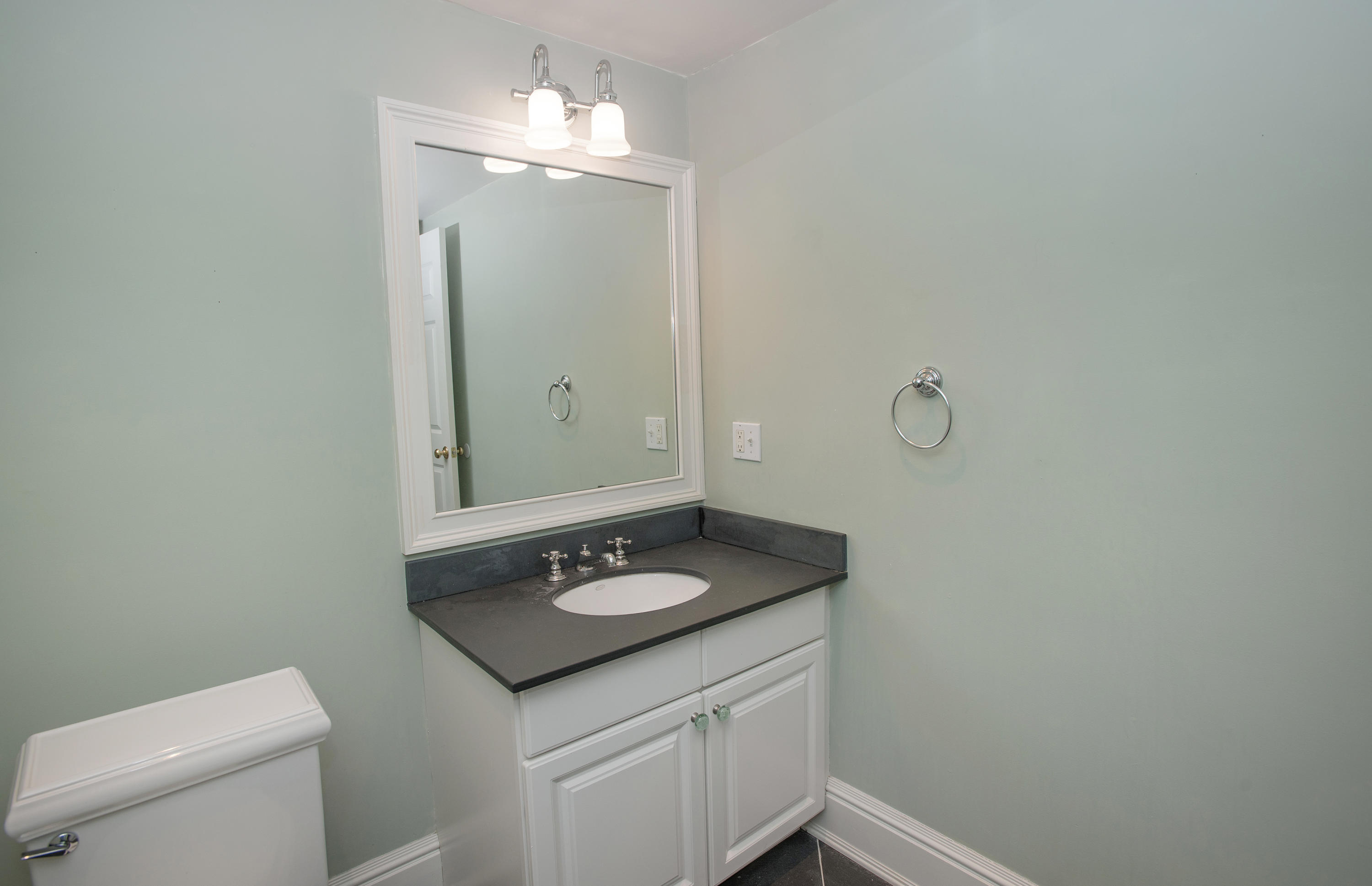 17 Brushy Ridge Road New Canaan, CT 06840 - Photo 28 of 35 a bathroom with a granite countertop sink and a mirror
