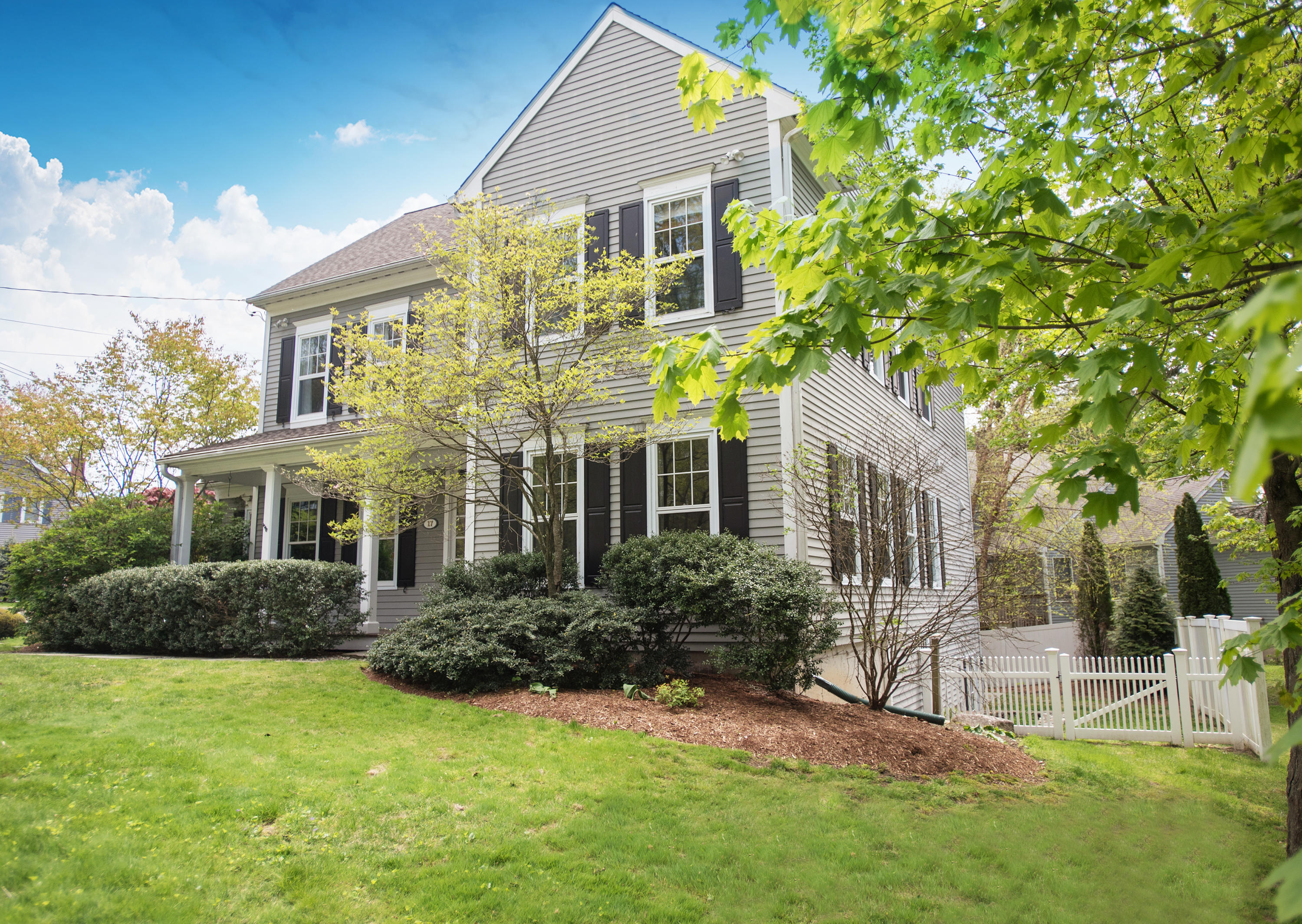 17 Brushy Ridge Road New Canaan, CT 06840 - Photo 4 of 35 a front view of a house with a yard