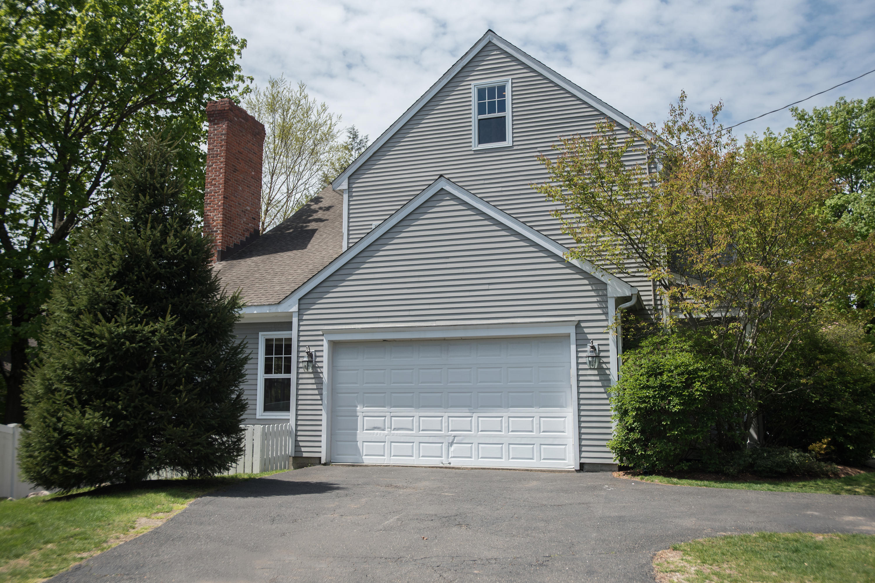 17 Brushy Ridge Road New Canaan, CT 06840 - Photo 34 of 35 a view of a house with a yard and garage