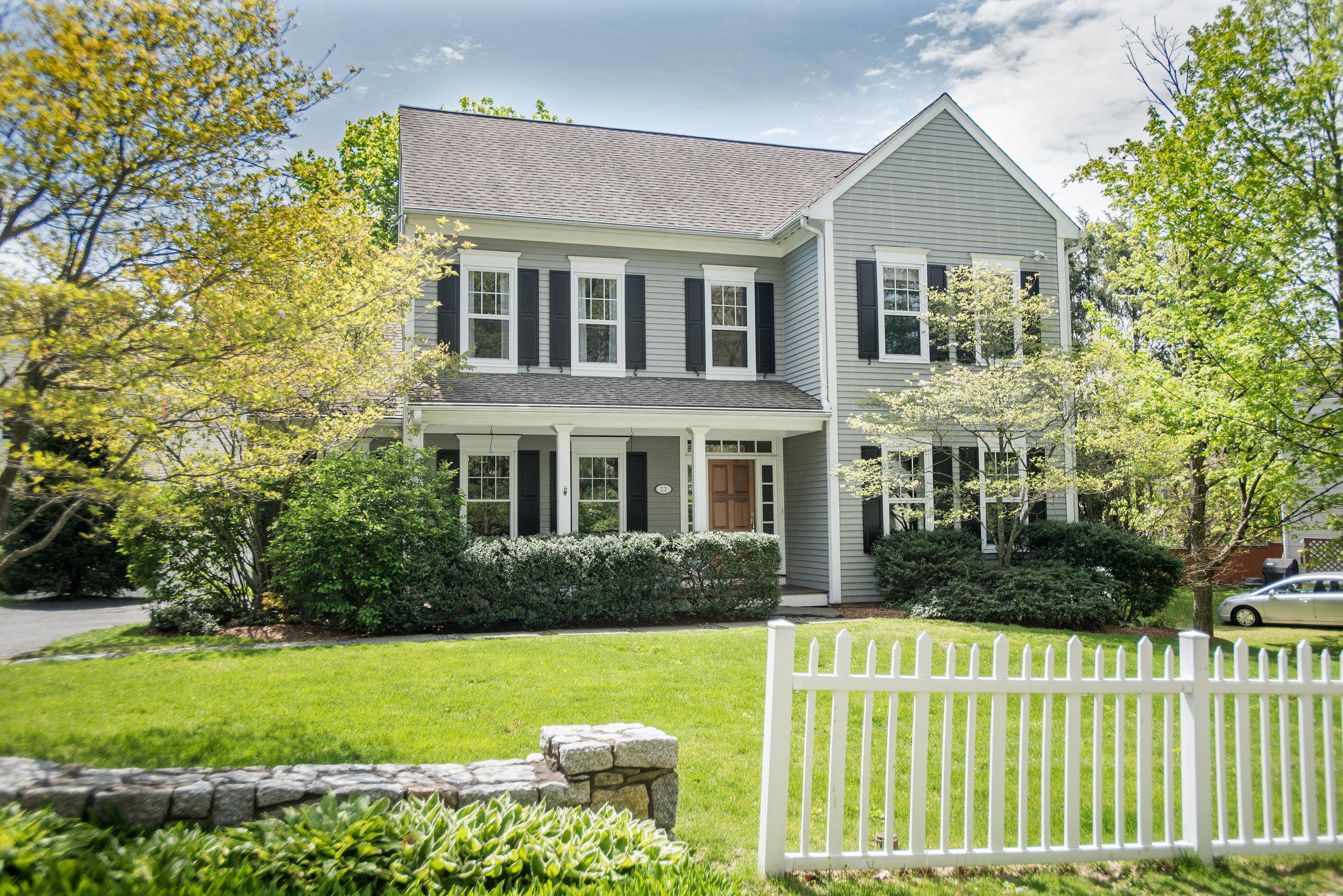 17 Brushy Ridge Road New Canaan, CT 06840 - Photo 35 of 35 a front view of a house with a yard