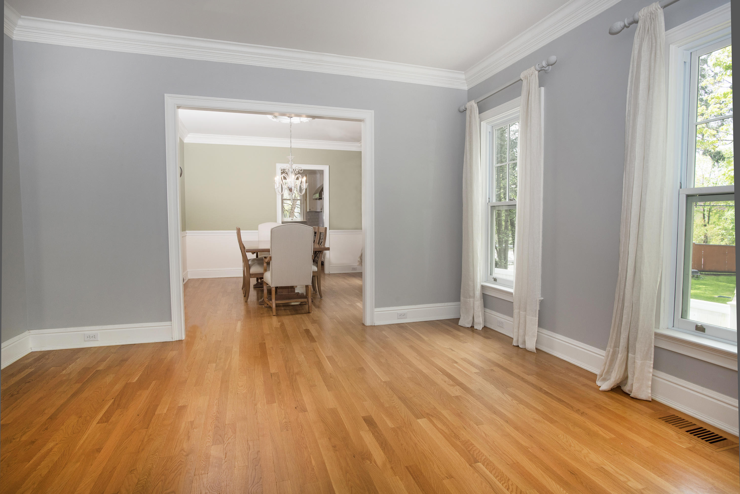 17 Brushy Ridge Road New Canaan, CT 06840 - Photo 6 of 35 a dining room with wooden floor and a floor to ceiling window