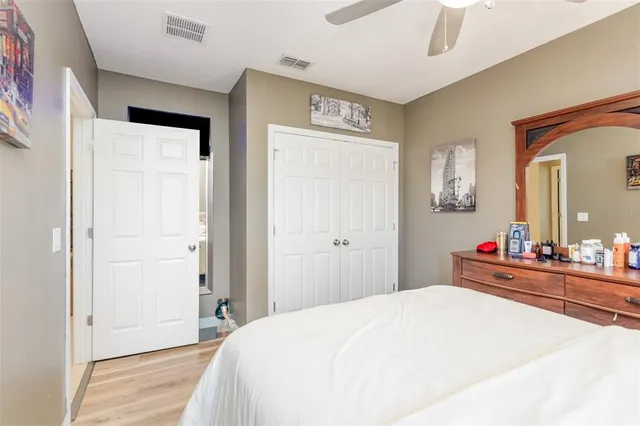 a bedroom with a bed and a dresser