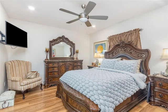 a bedroom with a bed and a television