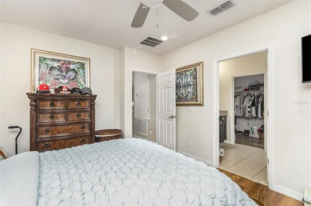 a bedroom with a bed and a dresser