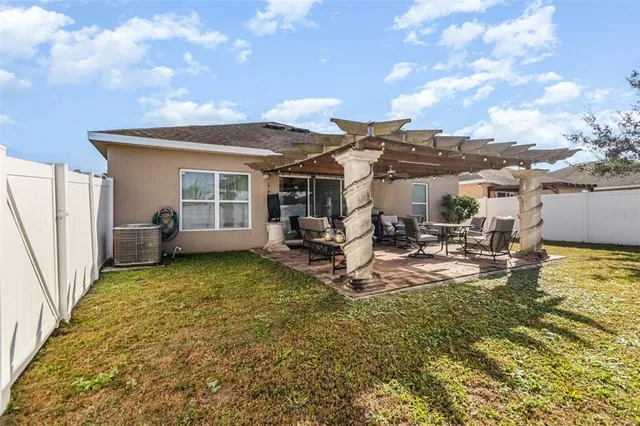 a view of a backyard with a sitting area