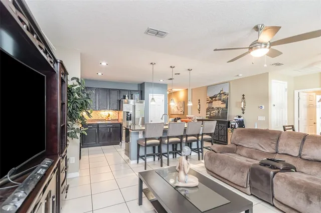a living room with lots of furniture and a flat screen tv