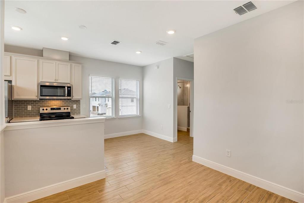 6547 Rover Way St. Cloud, FL 34771 - Photo 5 of 11 a kitchen with stainless steel appliances a refrigerator sink and microwave