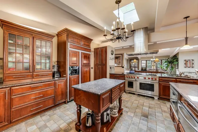 a living room with furniture ceiling fan and a rug
