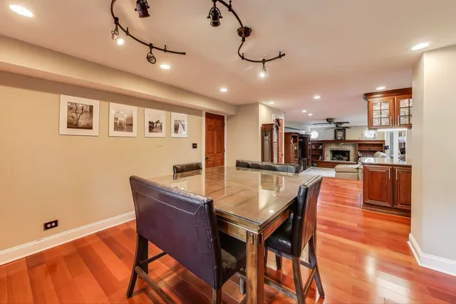 a living room with lots of furniture and wooden floors