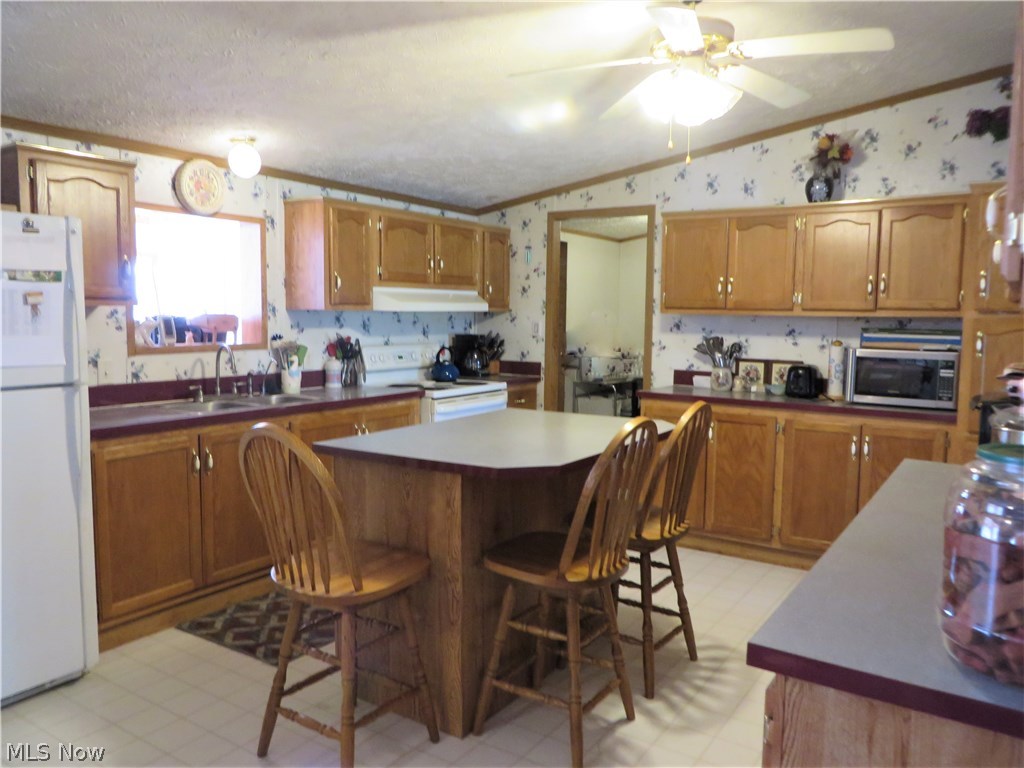 15335 Moseley Road Madison, OH 44057 - Photo 4 of 34 Main home kitchen with laundry room