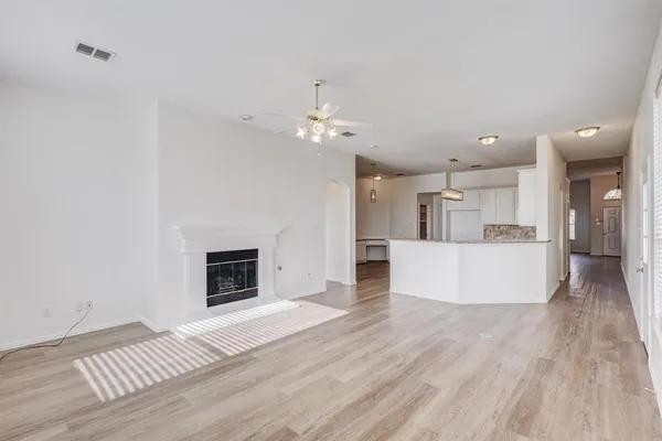 a view of a kitchen with furniture and a fireplace