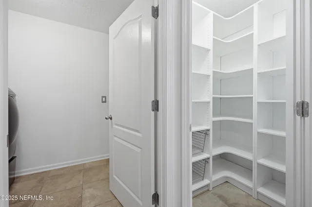 a view of an empty walk in closet
