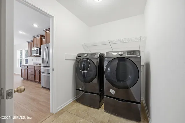 a view of a storage & utility room with racks on the wall