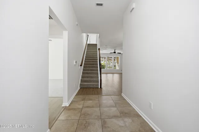 a view of entryway and hall with a window
