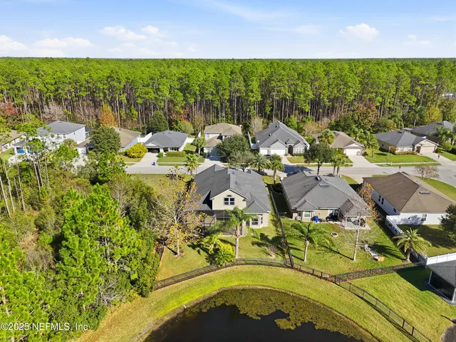 an aerial view of a house with swimming pool