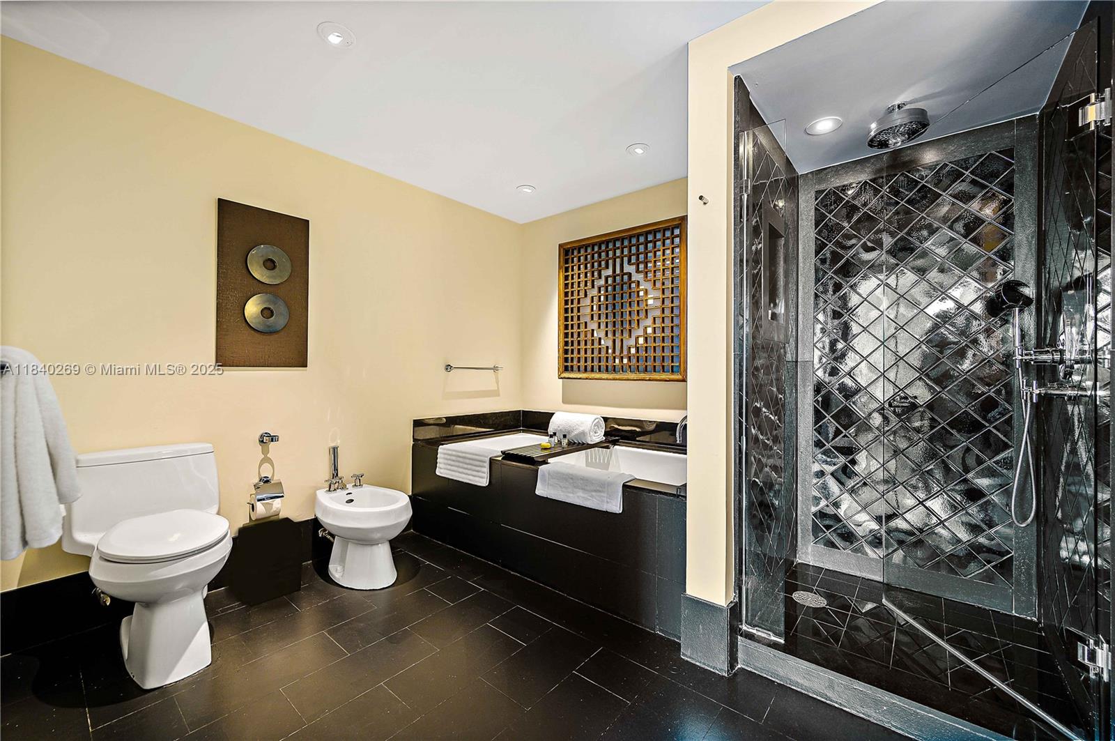 101 20th Street, Unit 3504 Miami Beach, FL 33139 - Photo 14 of 25 a bathroom with a toilet sink and shower