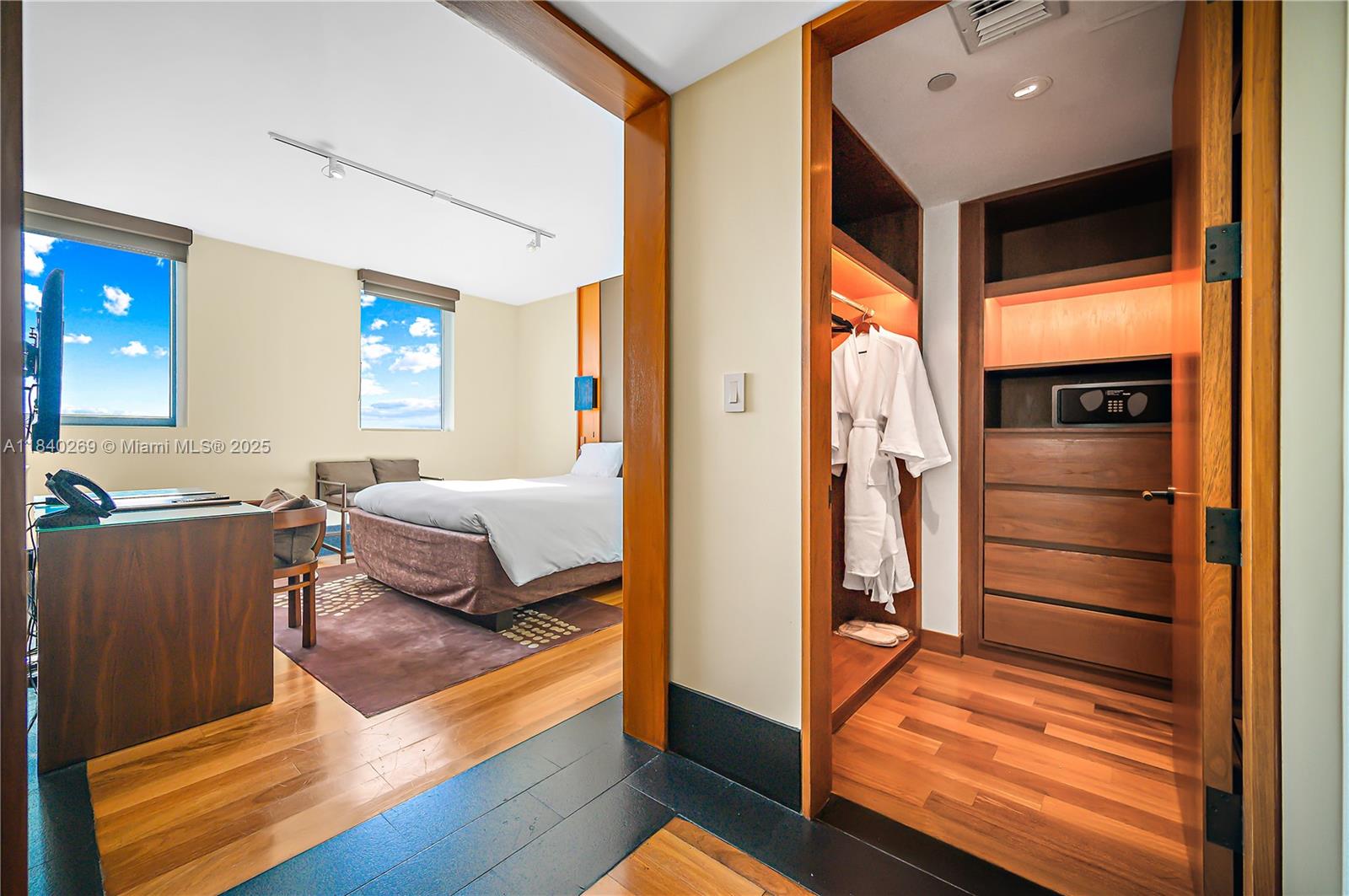 101 20th Street, Unit 3504 Miami Beach, FL 33139 - Photo 18 of 25 a bedroom with a bed and wooden floor