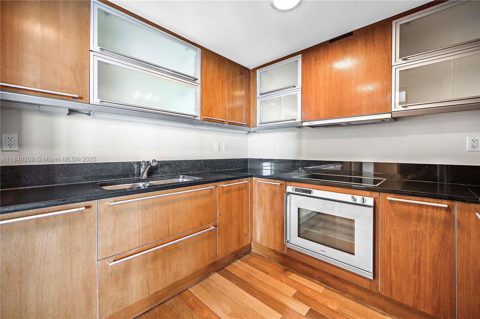 101 20th Street, Unit 3504 Miami Beach, FL 33139 - Photo 22 of 25 a kitchen with stainless steel appliances granite countertop a sink stove and microwave