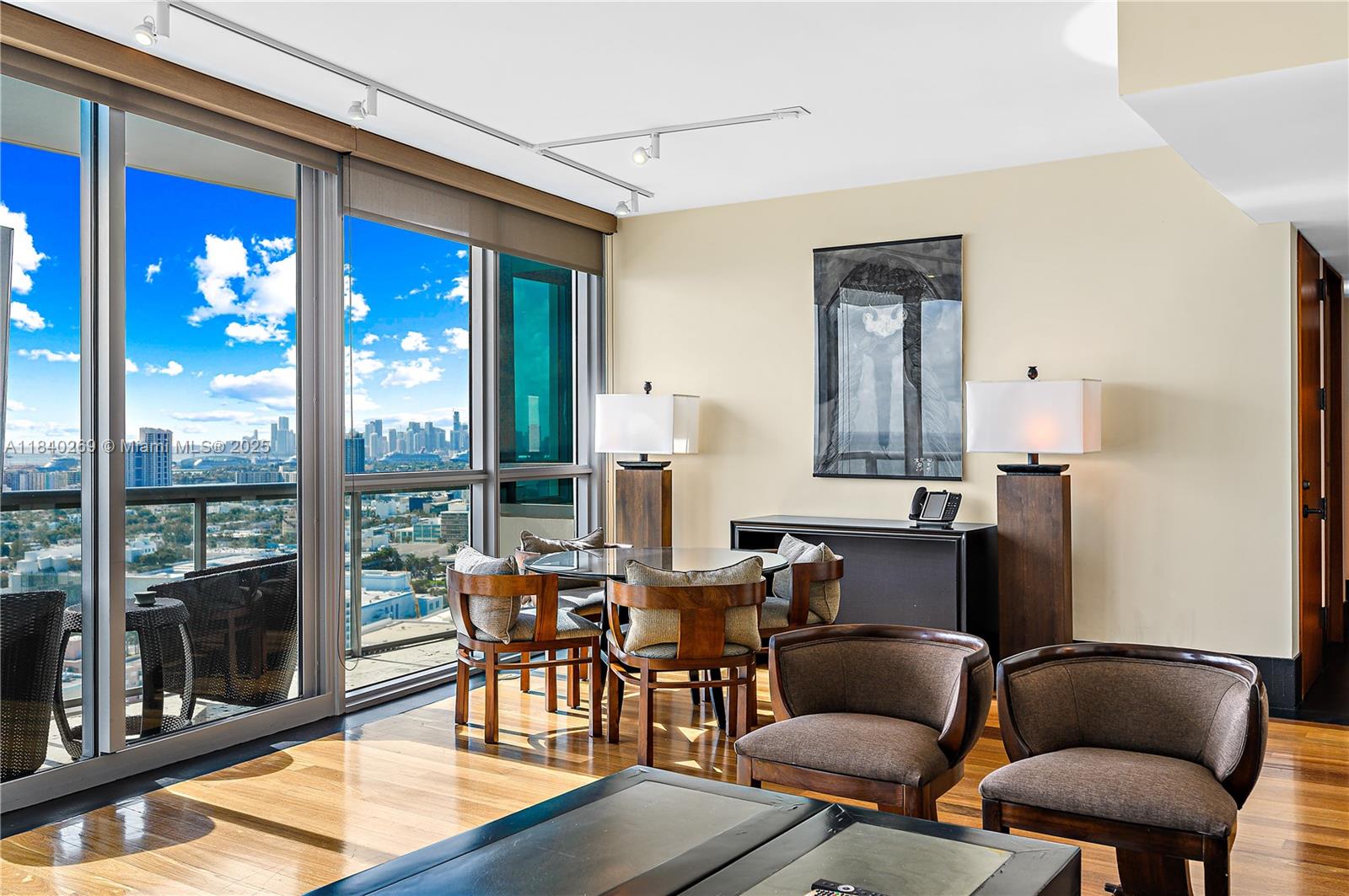 101 20th Street, Unit 3504 Miami Beach, FL 33139 - Photo 7 of 25 a living room with furniture and a floor to ceiling window