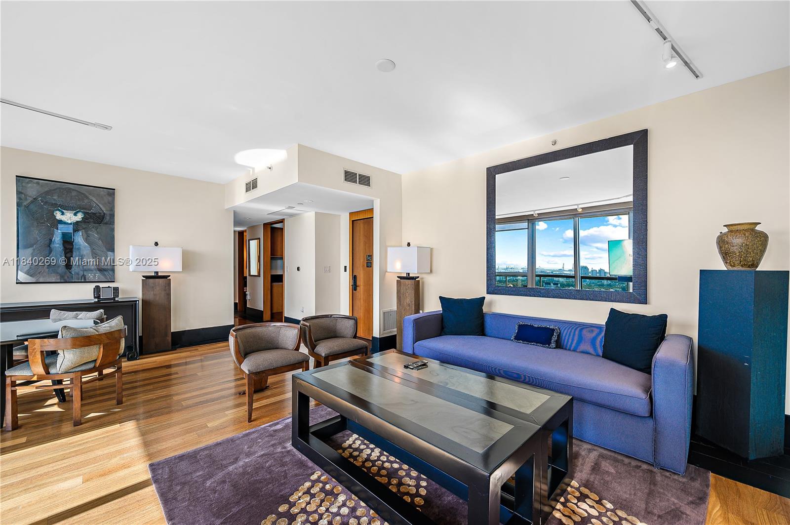 101 20th Street, Unit 3504 Miami Beach, FL 33139 - Photo 8 of 25 a living room with furniture wooden floor and a window