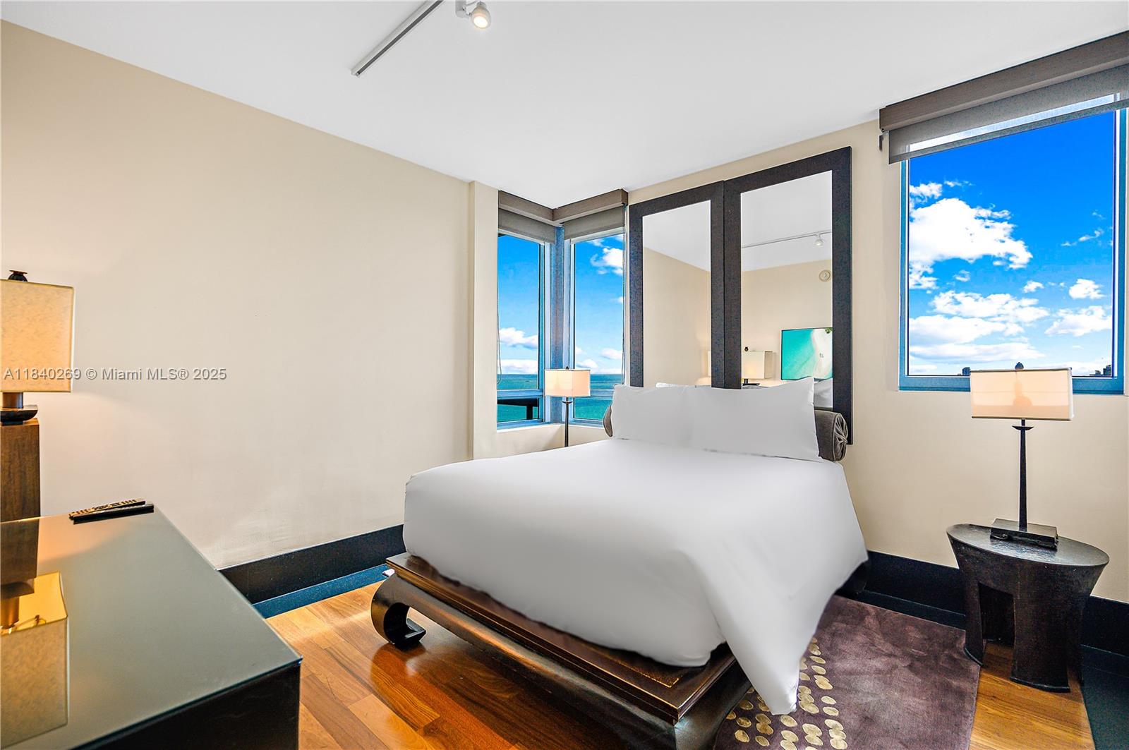 101 20th Street, Unit 3504 Miami Beach, FL 33139 - Photo 9 of 25 a bedroom with a bed and large window