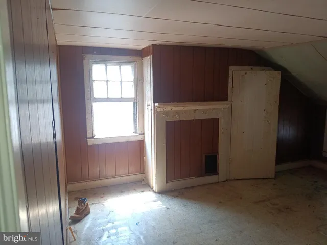 a view of a big room with windows and cabinet