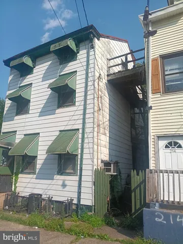 a view of a house with a yard and garage