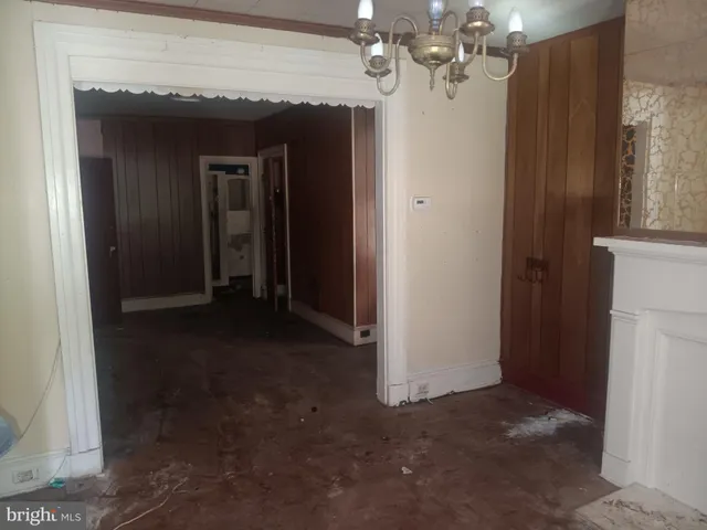 a view of a chandelier in big room and hallway
