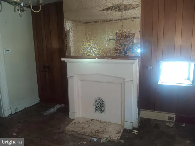 an empty room with closet and wooden door