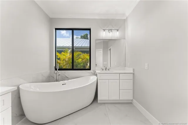 a bathroom with a bathtub and window