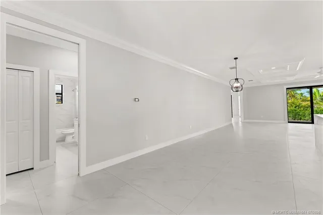 an empty room with a empty space and windows